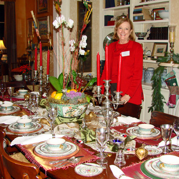Homeowner Fran Thomas sets a beautiful table for the Holiday Tour
